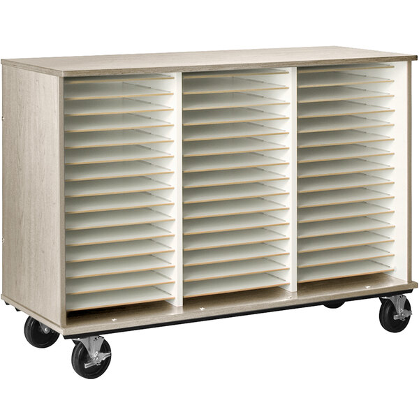 A natural elm I.D. Systems folio storage cabinet with wheels.
