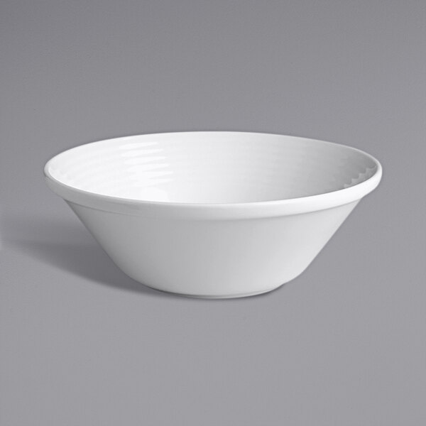 A RAK Porcelain ivory stackable bowl with an embossed design on a white surface.