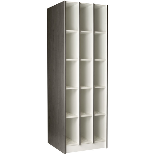 A tall dark elm I.D. Systems instrument storage locker with 15 compartments.