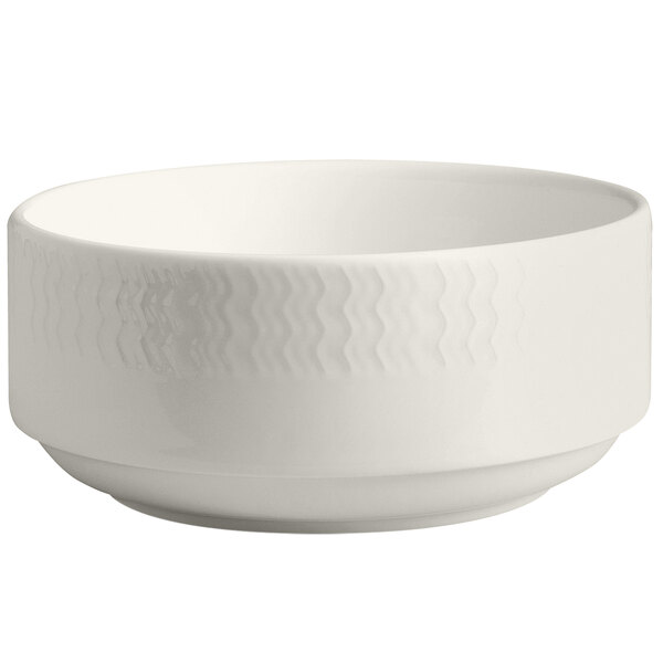 A RAK Porcelain ivory bowl with embossed wavy lines on the rim.