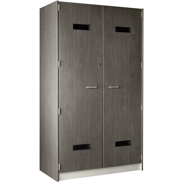 A dark elm locker with black handles on two doors.