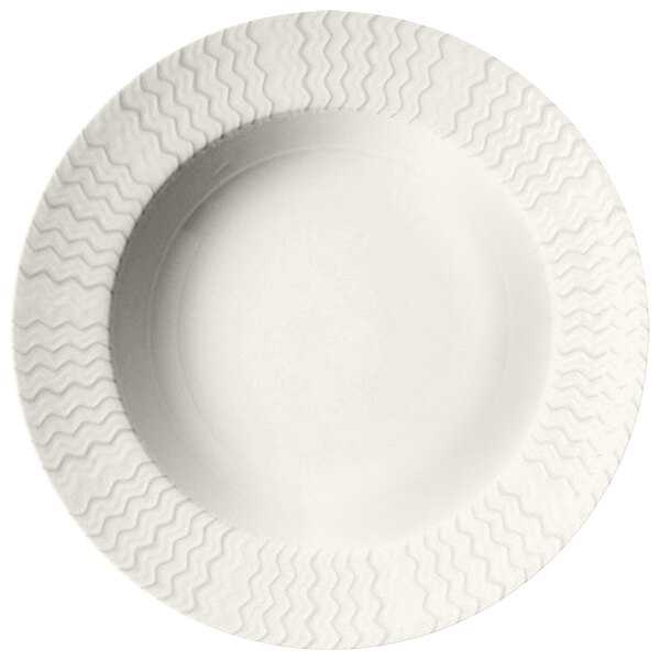 A RAK Porcelain ivory porcelain plate with a wavy pattern.