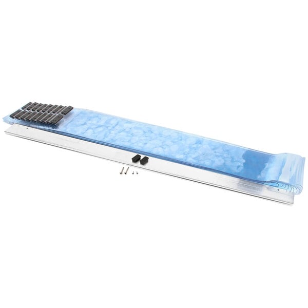 A plastic wrap with black handles on a blue and silver rectangular object.