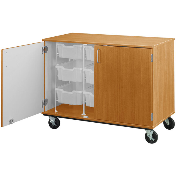 A maple I.D. Systems mobile storage cabinet with open door and 9 bins inside.