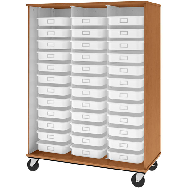 A medium cherry wooden storage cabinet with white plastic bins on shelves.