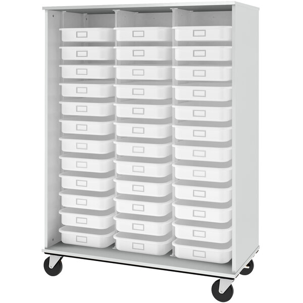 A grey I.D. Systems mobile storage cabinet with shelves and trays.