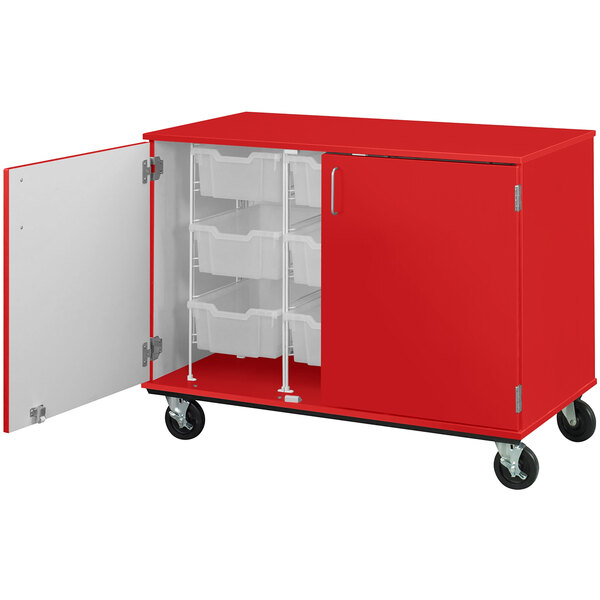A red I.D. Systems mobile storage cabinet with open shelves and bins.