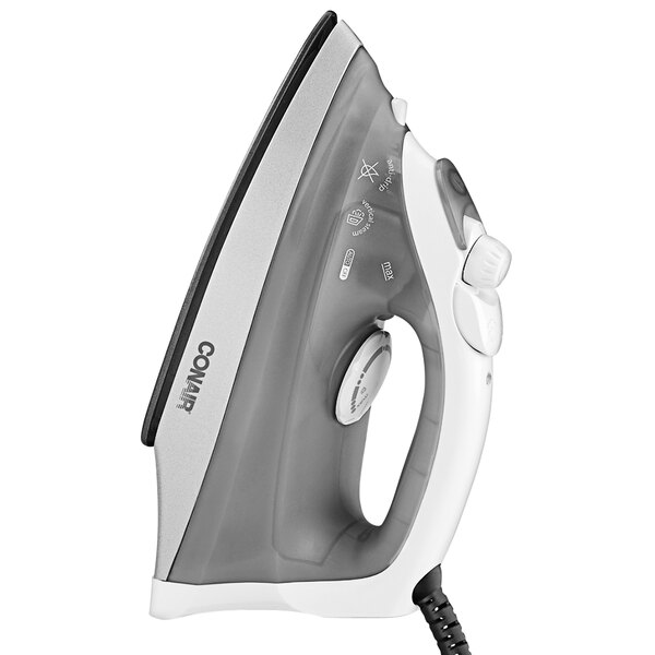 A Conair white and black steam and dry iron with a cord.