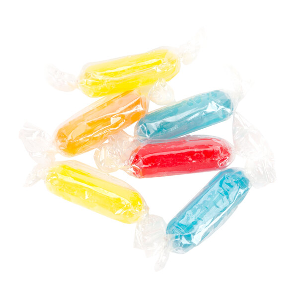 Assorted fruit rods in plastic bags with colorful wrappers.