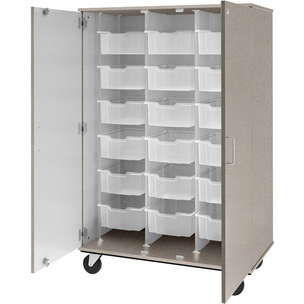 A grey mobile storage cabinet with many plastic bins inside.