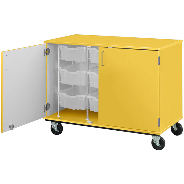 A sun yellow mobile storage cabinet with shelves and bins inside.