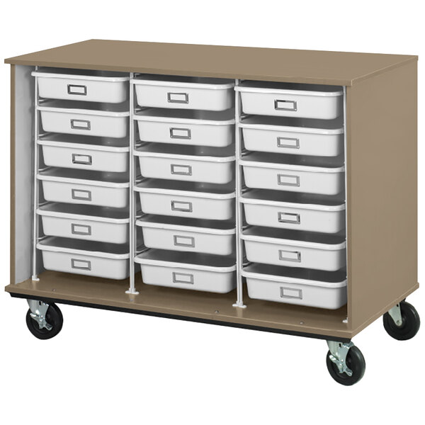 A white I.D. Systems mobile storage cabinet with many white plastic drawers on metal racks.