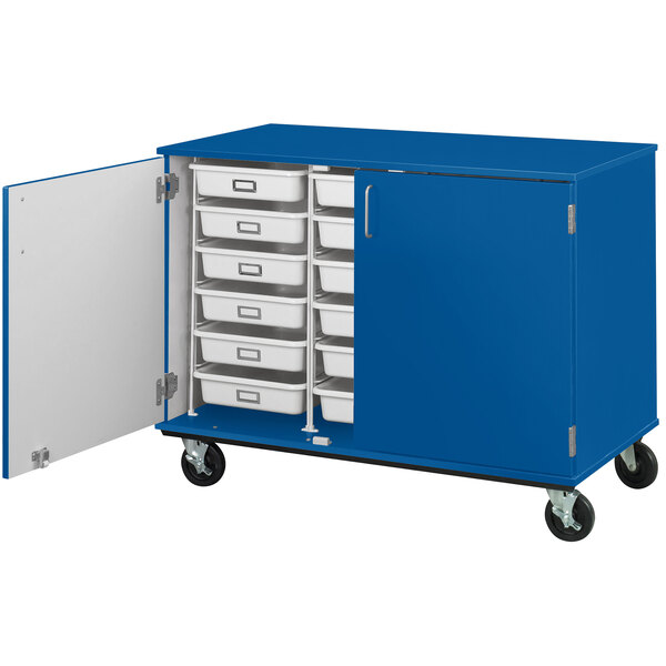 A blue mobile storage cabinet with an open drawer.