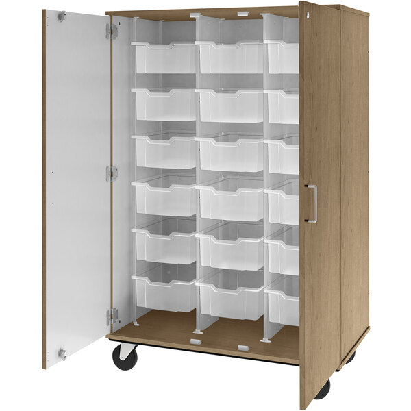 A wooden storage cabinet with white bins inside.