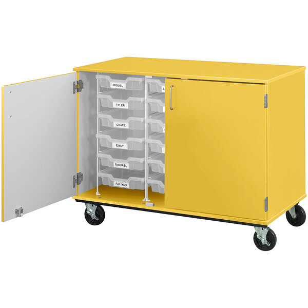 A sun yellow I.D. Systems mobile storage cabinet with yellow drawers on wheels.