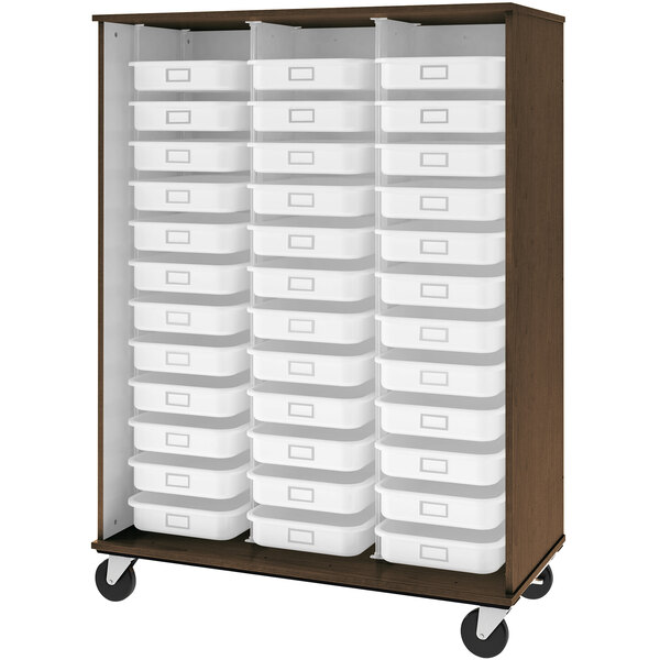 A dark walnut mobile storage cabinet with white plastic bins on shelves.