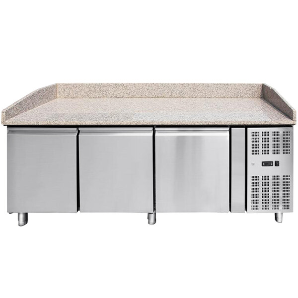 An Omcan refrigerated pizza prep table with a granite top and drawers.
