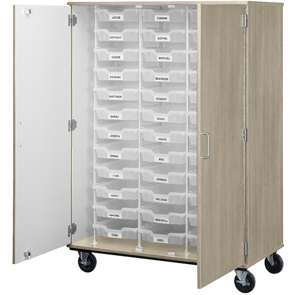 A large mobile storage cabinet with (36) drawers on wheels.