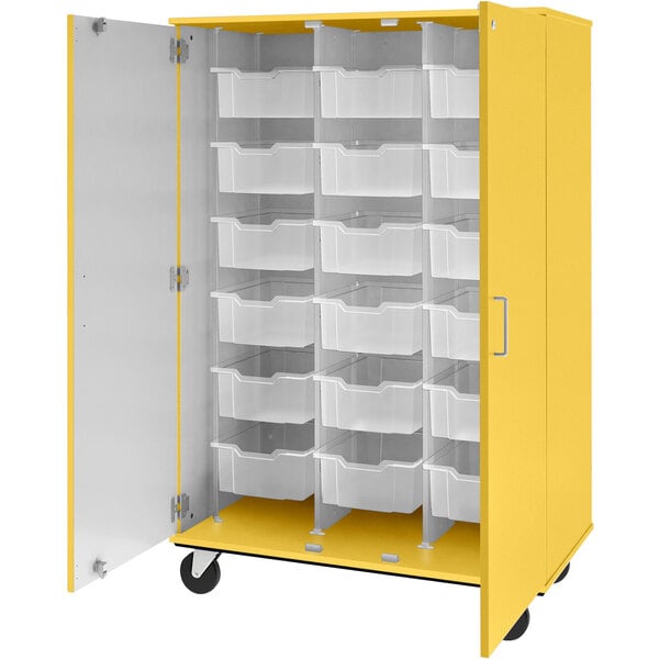 A sun yellow storage cabinet with white bins on the doors.