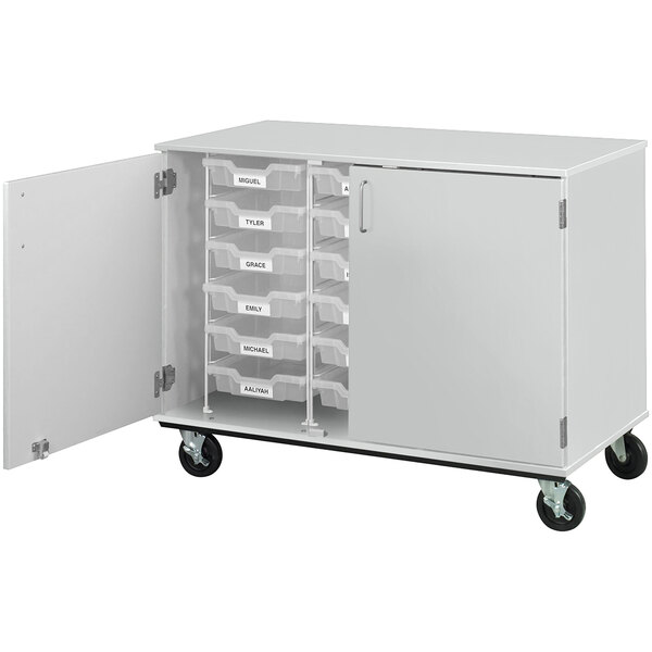 A fashion grey mobile storage cabinet with 18 drawers on wheels.