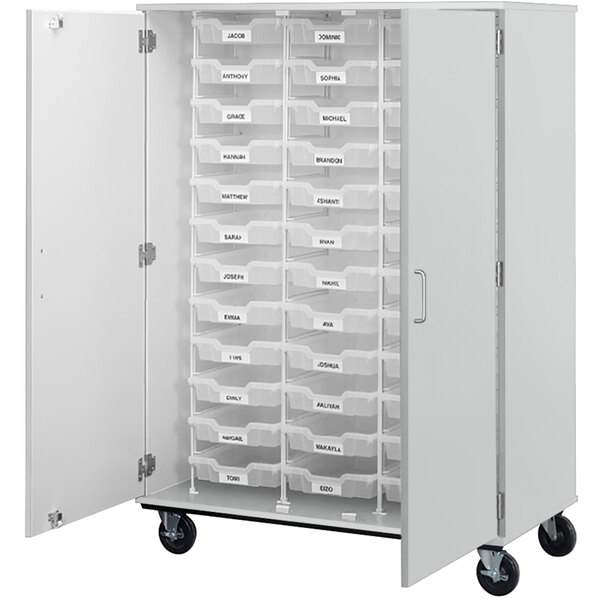 A white I.D. Systems mobile storage cabinet with shelves and bins.