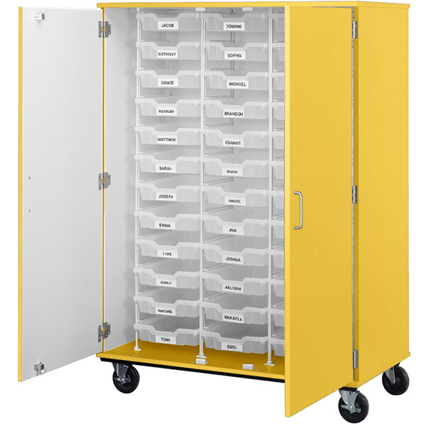 A yellow I.D. Systems mobile storage cabinet with white bins and drawers.