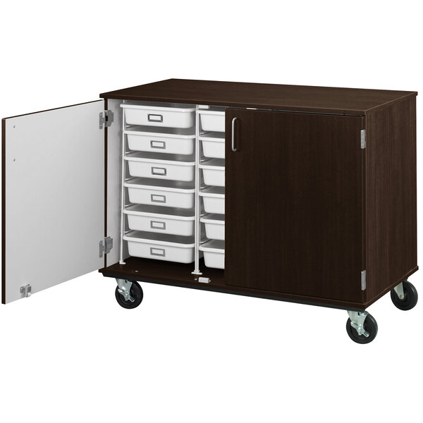 A brown I.D. Systems mobile storage cabinet with trays on wheels.