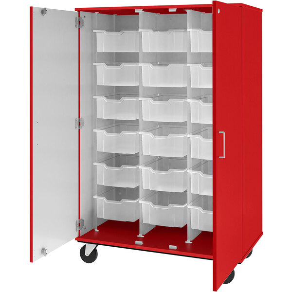 A red storage cabinet with white bins.