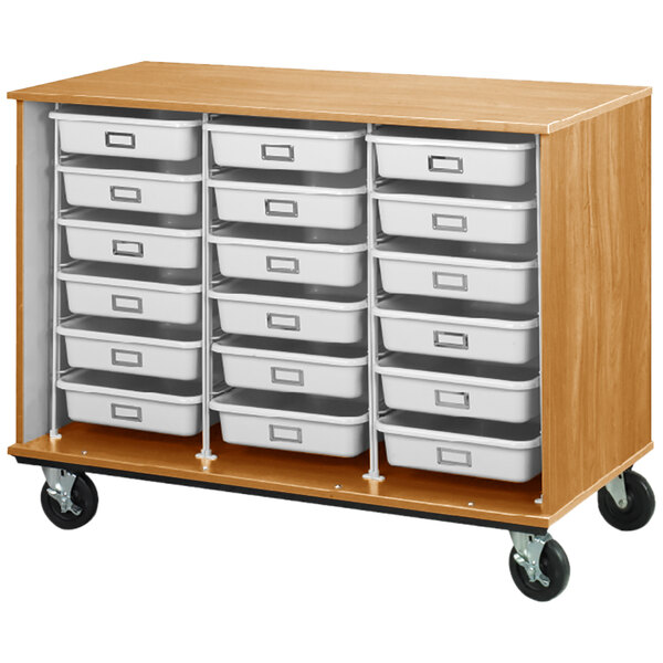 A maple mobile storage cabinet with white trays on a wooden rack.
