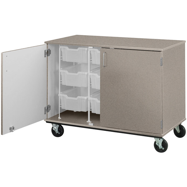 A grey I.D. Systems mobile storage cabinet with open shelves and bins on wheels.