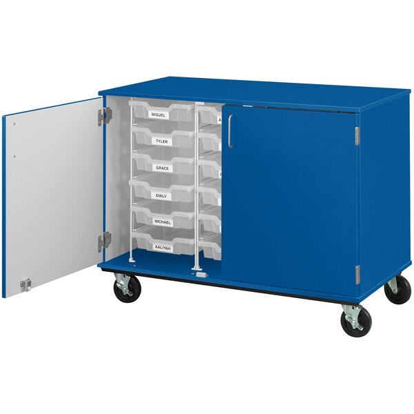 A blue I.D. Systems mobile storage cabinet with drawers and a door open.