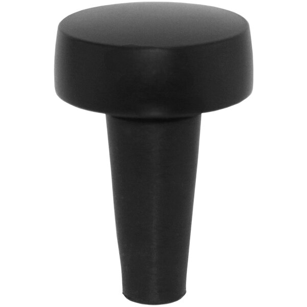 A black object with a round top on a white background.