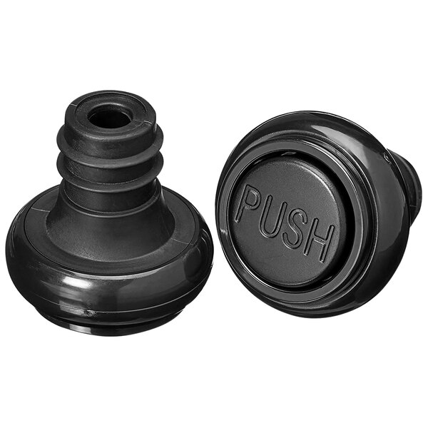 A close-up of a black Franmara Ultra-Vac bottle stopper with a round push button.