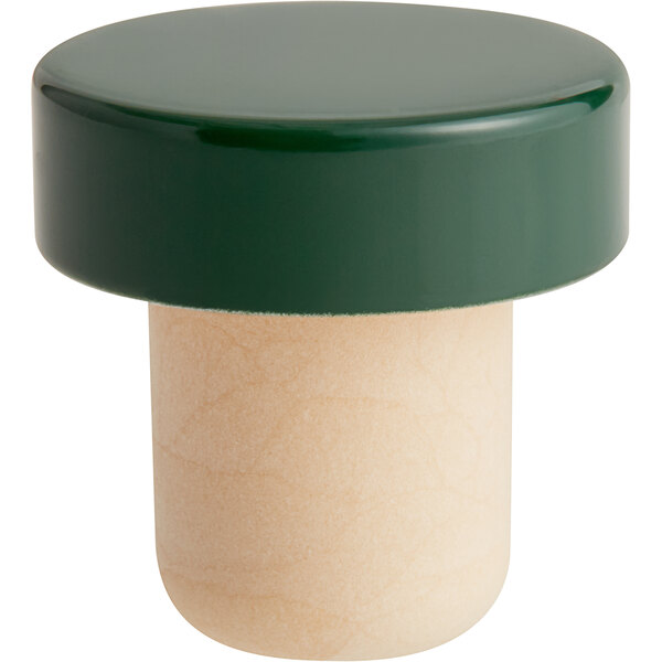 A green cylinder with a green and white plastic knob on top.