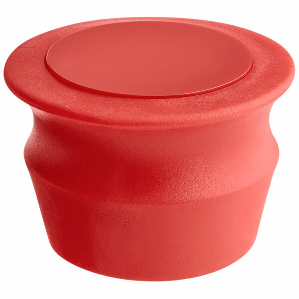 A red container with a round top and a white lid with a red button.