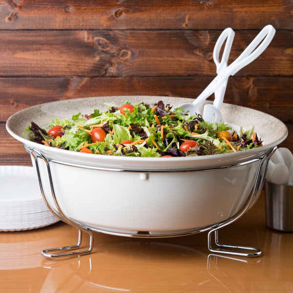 A chrome rack holding 6 white bowls of salad.