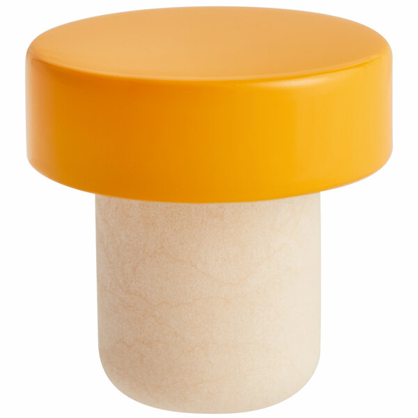 A close up of a yellow cylinder with a white aluminum top.