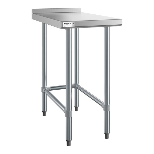 A stainless steel table with four legs, a flat top surface, and a raised backsplash along the back edge.