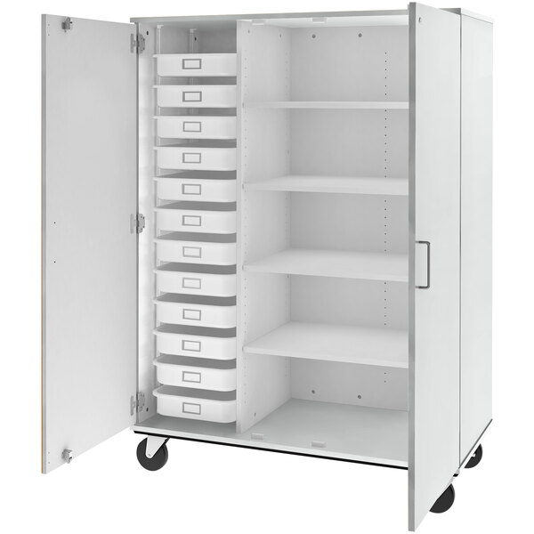 A white I.D. Systems mobile storage cabinet with trays and shelves.