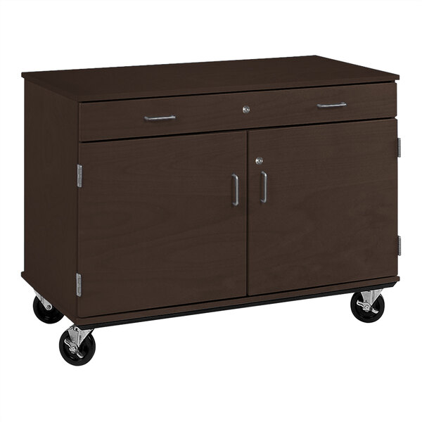 A brown I.D. Systems mobile storage cabinet with two doors and a drawer on wheels.