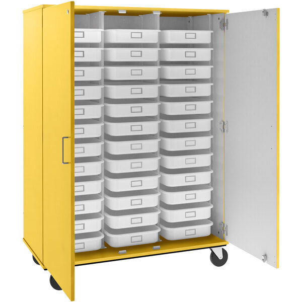A sun yellow I.D. Systems mobile storage cabinet with white trays and bins.