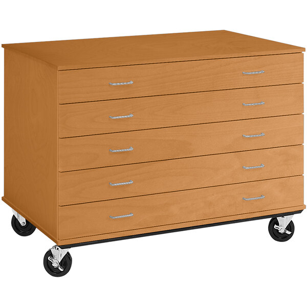 A light oak wooden five drawer mobile storage cabinet on wheels.