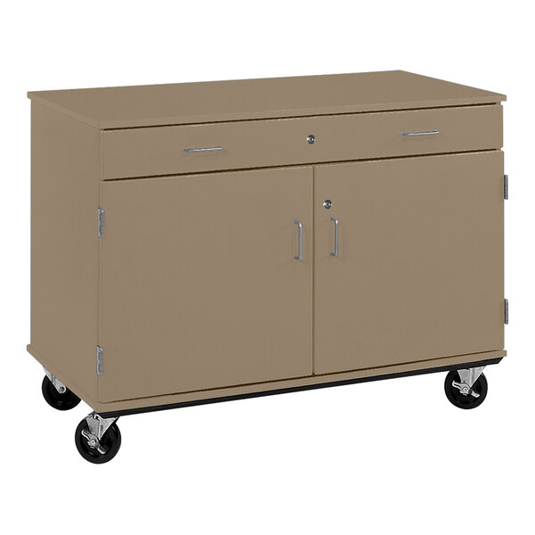 A tan and brown I.D. Systems mobile storage cabinet with drawer on wheels.