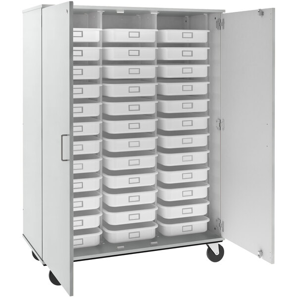 An I.D. Systems white mobile storage cabinet with trays inside.