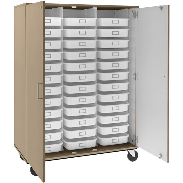 A tall I.D. Systems mobile storage cabinet with many trays inside.