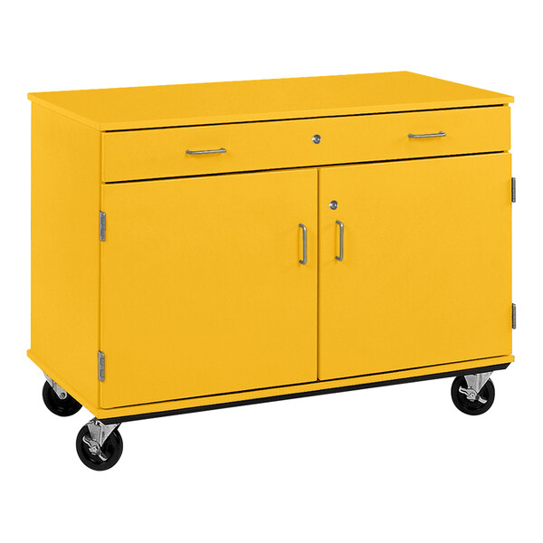 A sun yellow I.D. Systems mobile storage cabinet on wheels.