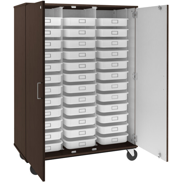 A brown I.D. Systems mobile storage cabinet with white trays.