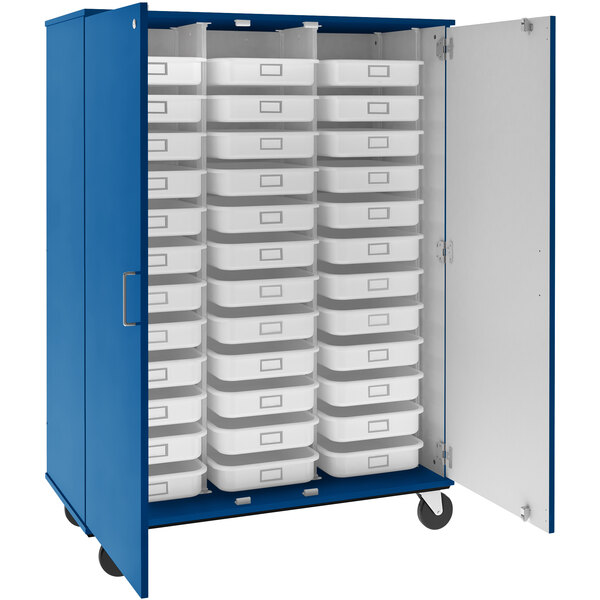 A royal blue metal storage cabinet with white trays inside.