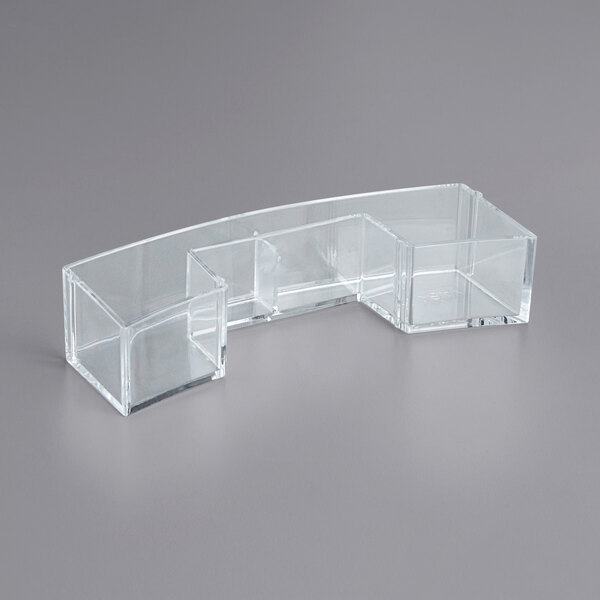 A clear plastic container with three compartments.