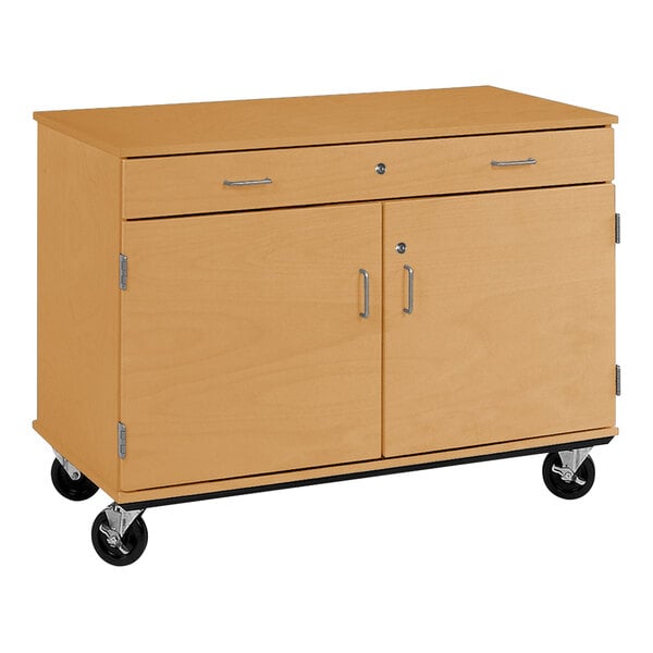 A maple I.D. Systems mobile storage cabinet with two doors and a drawer on wheels.